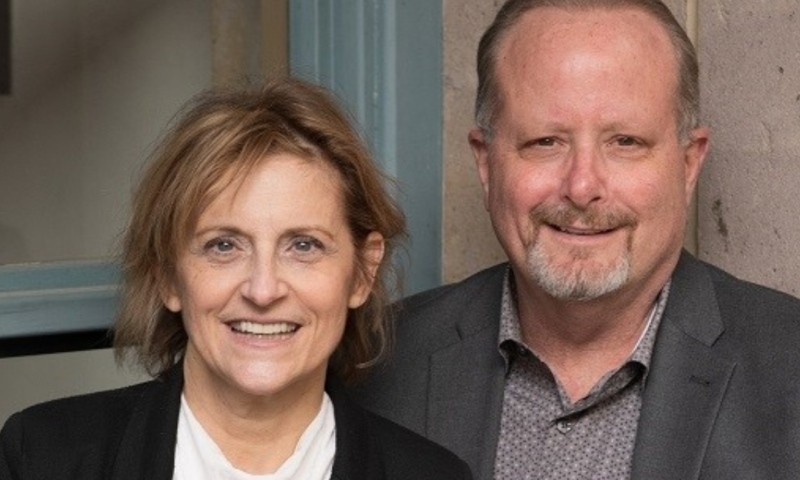 J.L. Yarrow and Leanne Yarrow holding their Time Forward Trilogy novel Future’s Dark Past